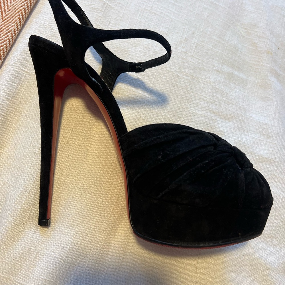 Never worn high heel peep toe Louboutin